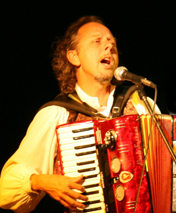 Filippo singing and playing accordion